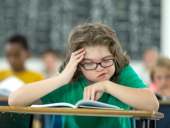 A young girl reading. 
