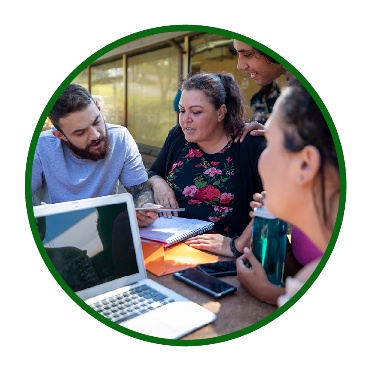 A group of people working together around a table.