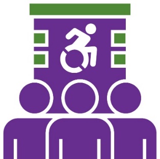 A group of people in front of a building with a disability icon on it. 