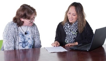 A person explaining a document to someone else. 