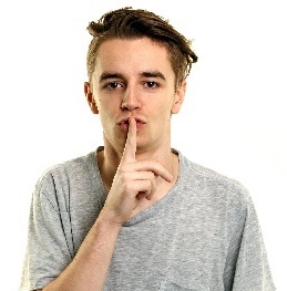 A person with their finger to their lips. 