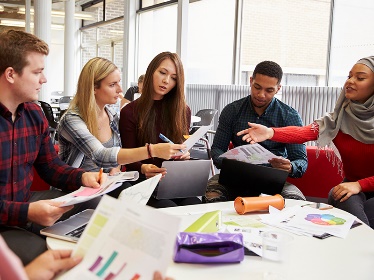A group of people in a meeting. 