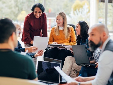 A group of people in a meeting. 