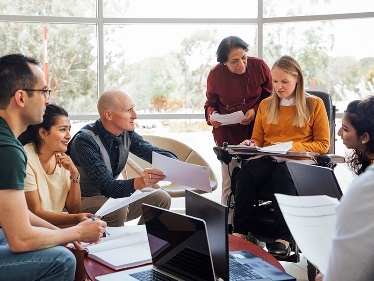 A group of people having a meeting. 