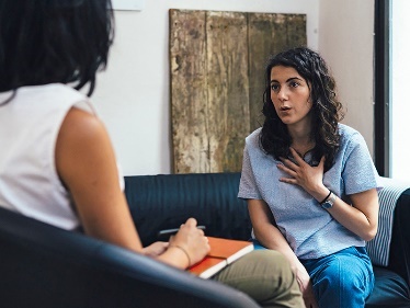 A person talking to a psychologist. 