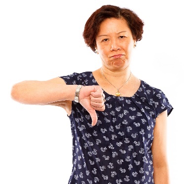 A person with their thumb down. 