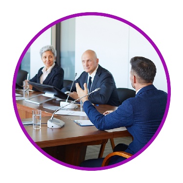 A group of people at a meeting.