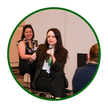 Someone using a microphone at a workshop.