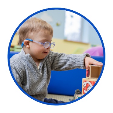 A child with disability playing with toys.