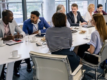 A group of people having a meeting. 