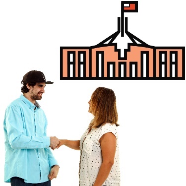 Two people shaking hands with a government building in the background. 