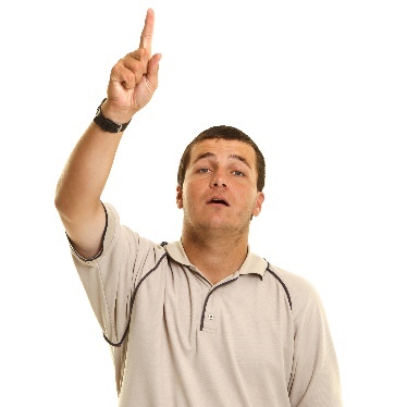 A person with their hand raised to say something.