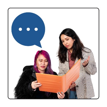 2 people talking about a document. 