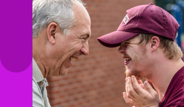 Young man laughing with grandfather